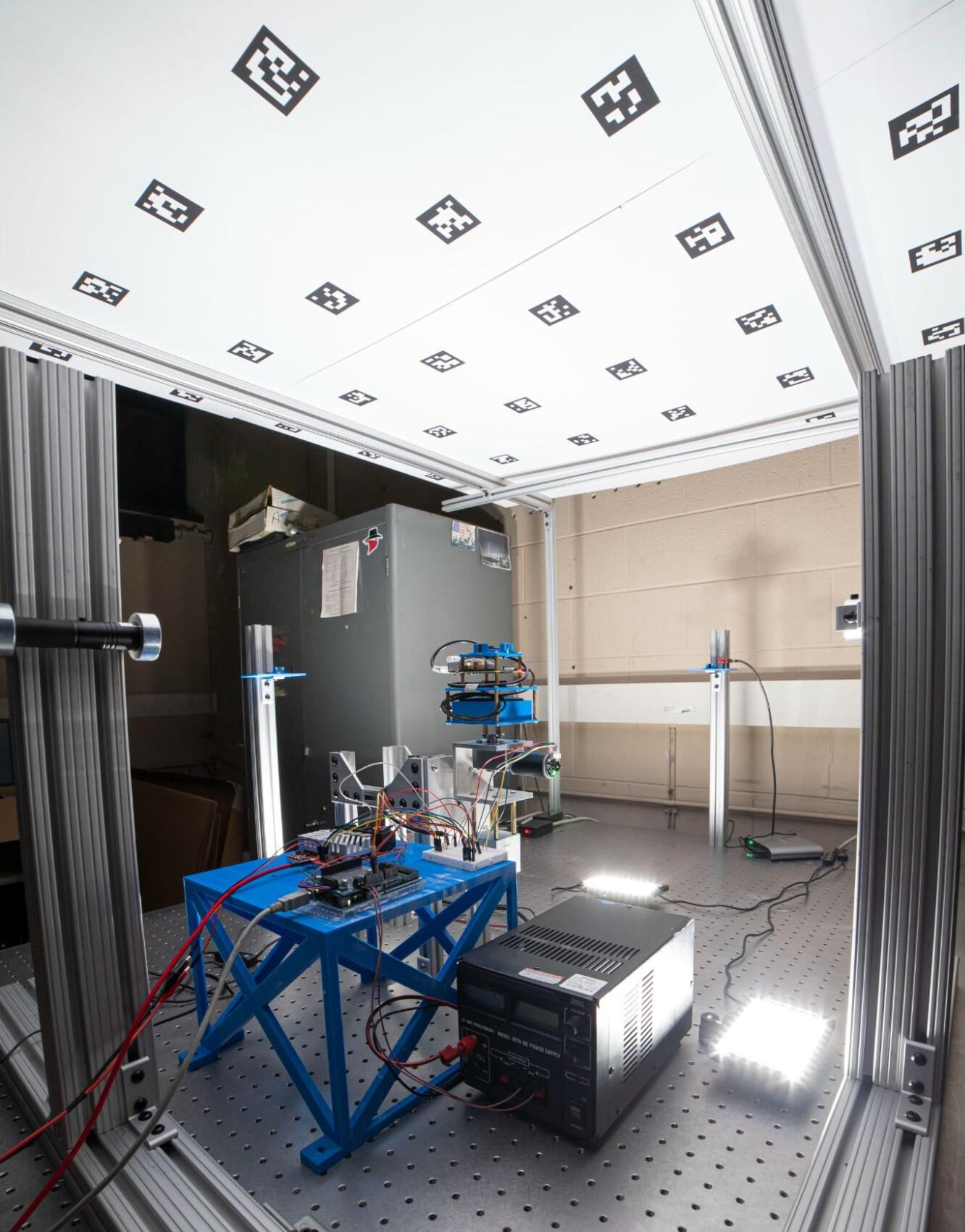 Cropped and exposure-adjusted photograph of laboratory hardware setup for characterizing a camera system.